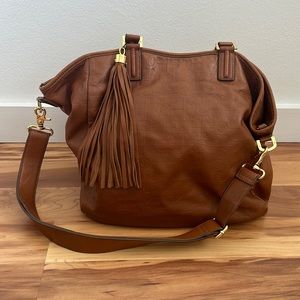 Tory Burch rich tan leather purse with gold hardwear.